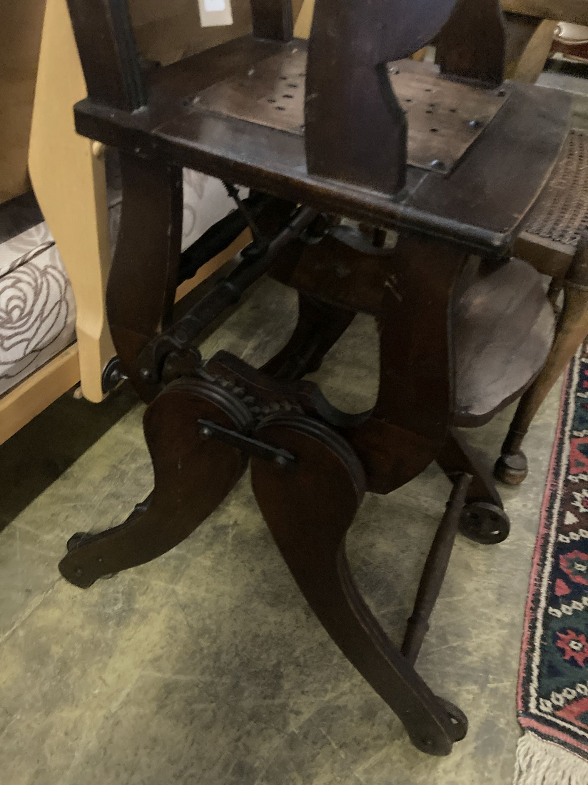 An early 20th century oak and beech childs metamorphic high chair